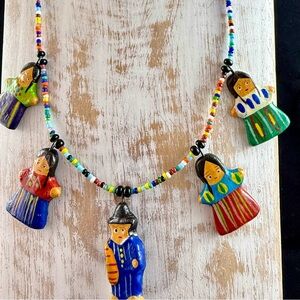 Handmade colorful Guatemalan worry doll beaded necklace.